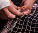 a fishing net being repaired