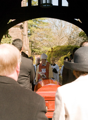The burial service of Frederic W McFarland, at the lychgate of St Mary's