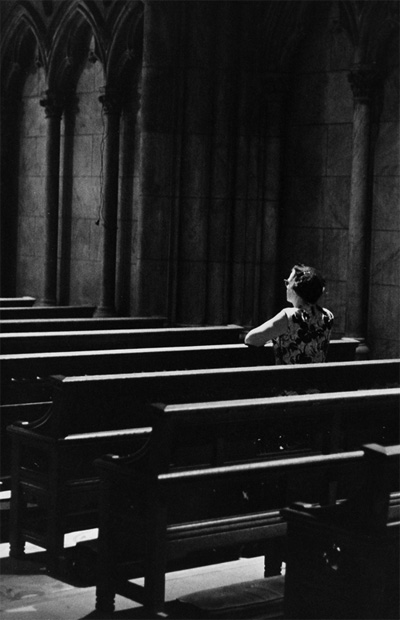Woman alone in a church